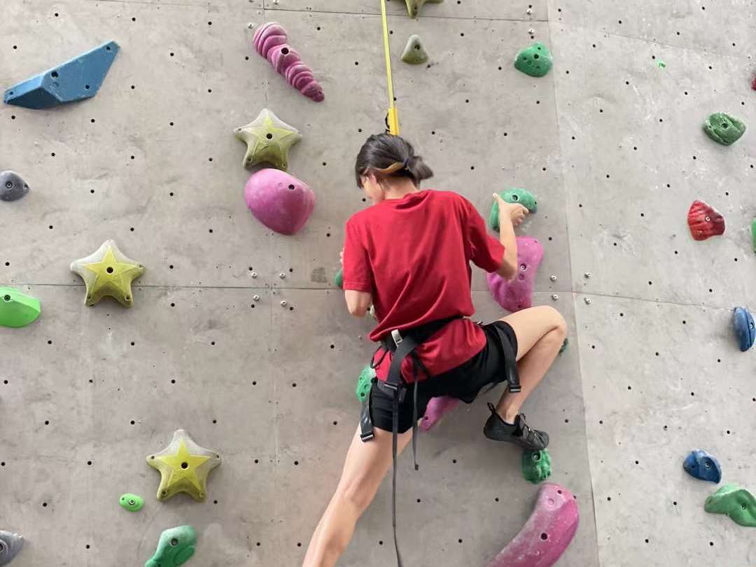 Georgia is rock climbing 